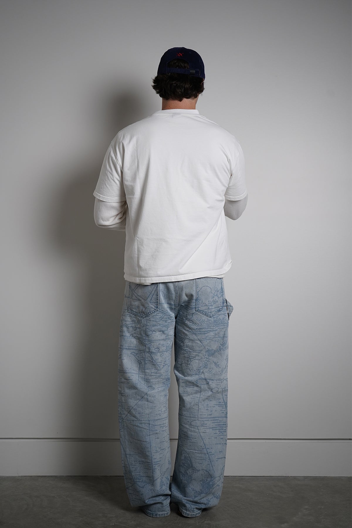 White First Son of The Sea Tee with whale shark graphic, full-length back view on model in light blue jeans