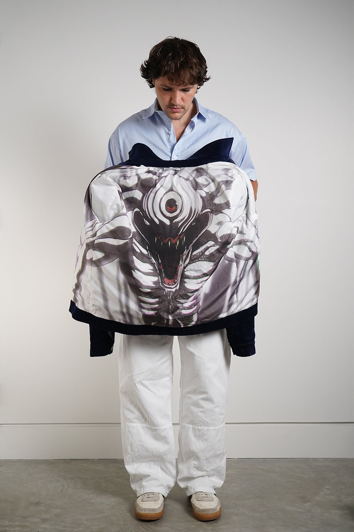Queen of Curses Jacket in navy with white skeletal graphic, displayed open to show interior lining.