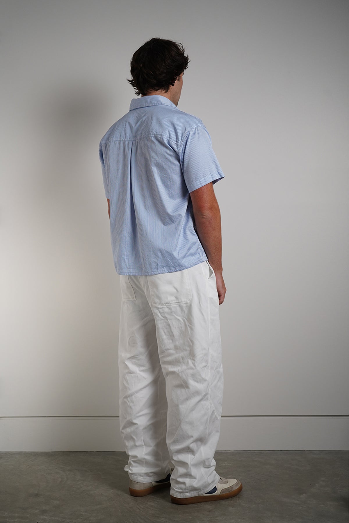 Bebop Work Shirt in light blue pinstripe, back view on model.