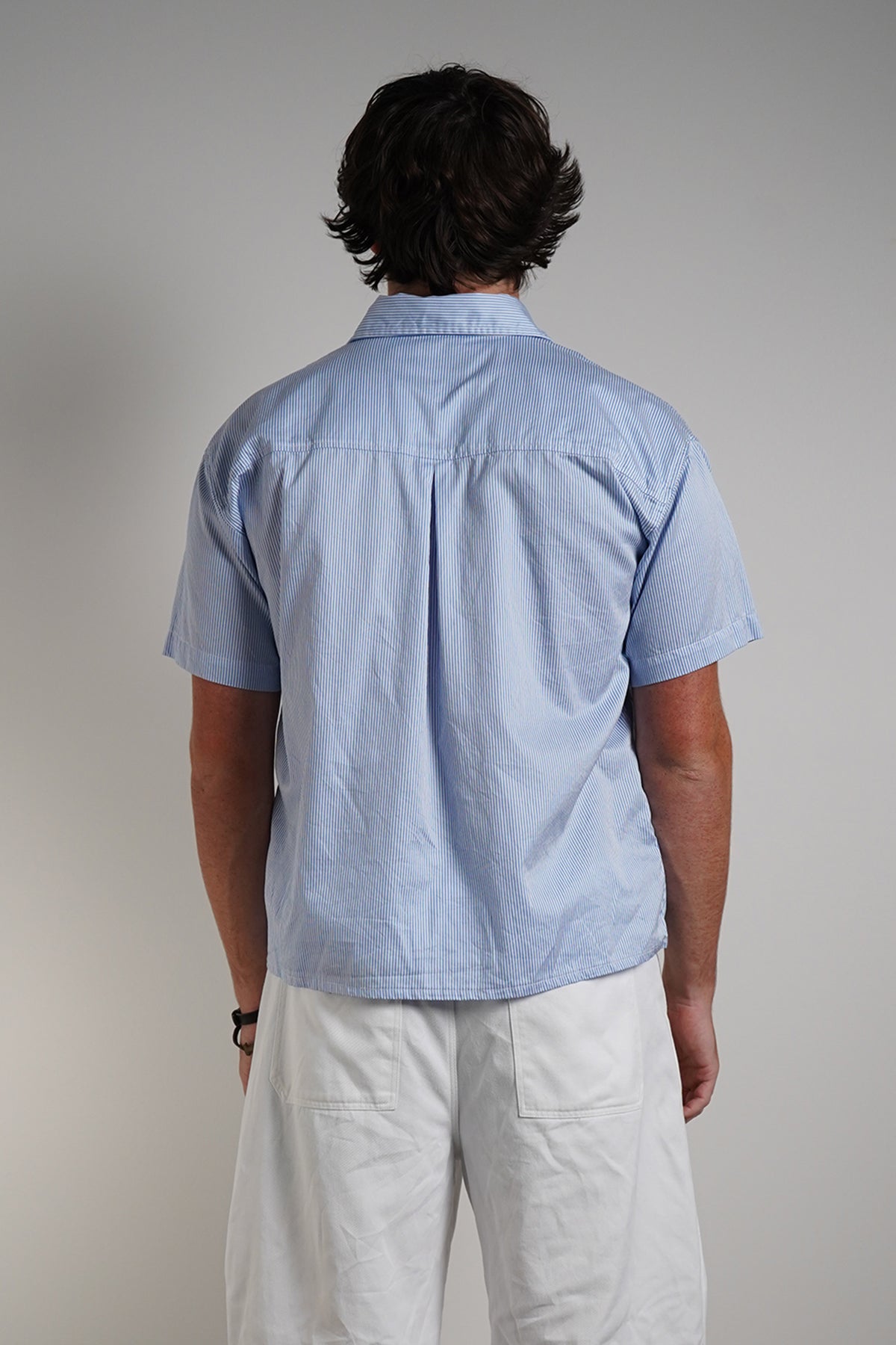 Bebop Work Shirt in light blue pinstripe, back view on model.