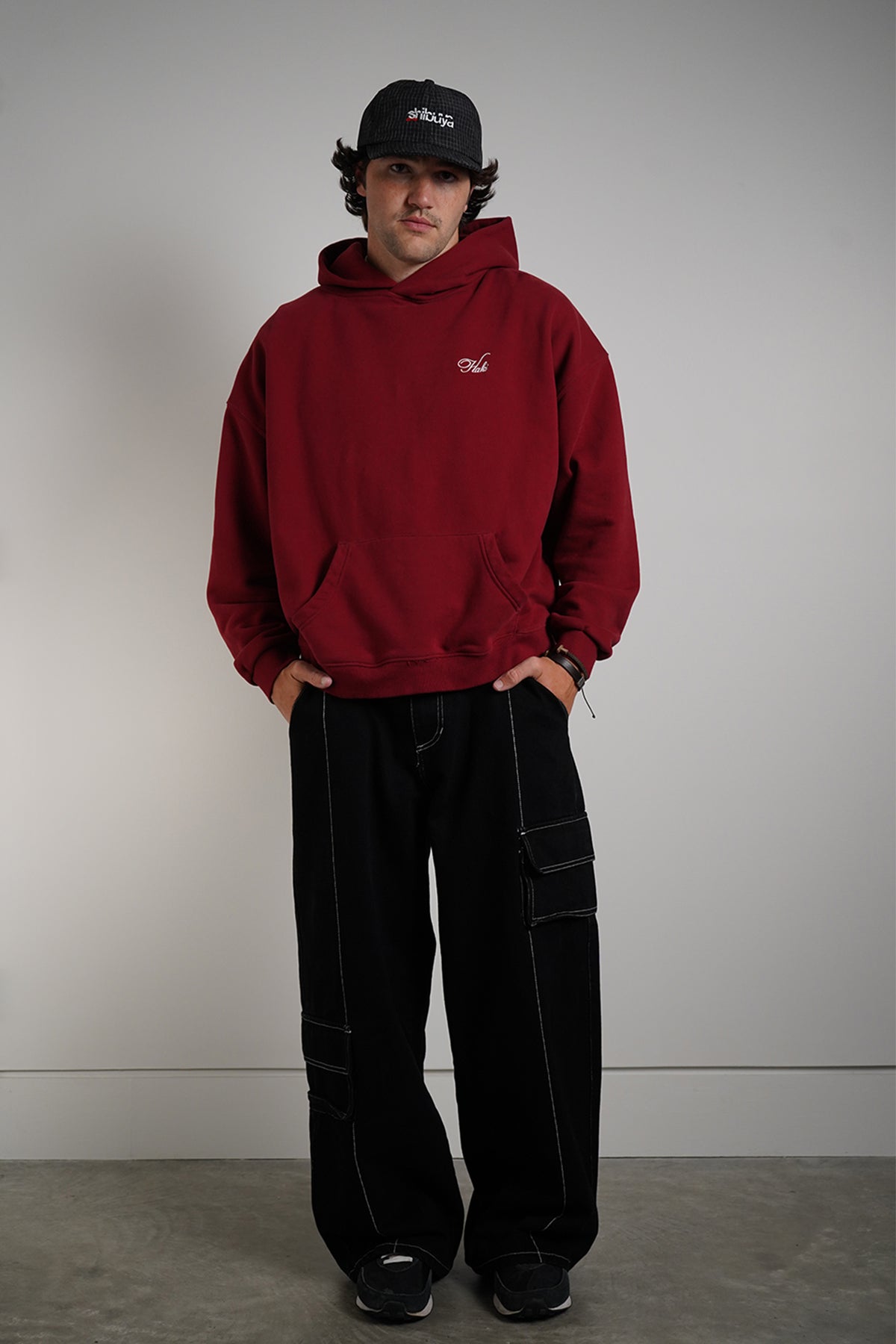 Come Over Hoodie in burgundy with embroidered "Haki" logo, front view on model