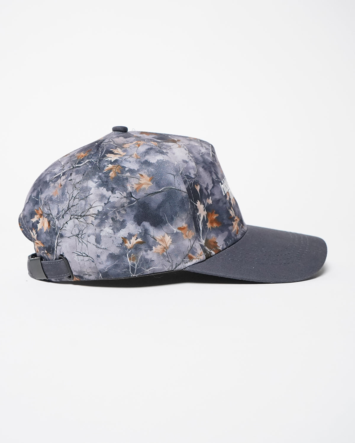 Hidden Inventory Hat in gray camo with white logo text, side view