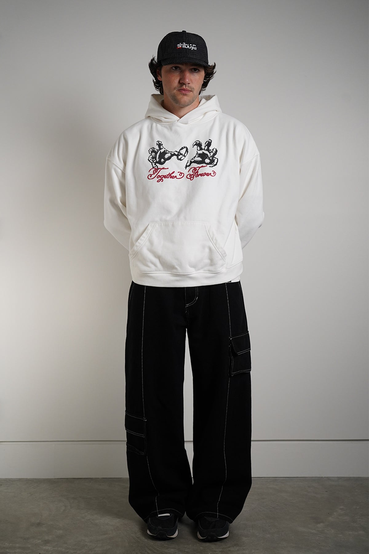 White Together Forever Hoodie with black hands-and-ring graphic and red Together Forever script, front view in model