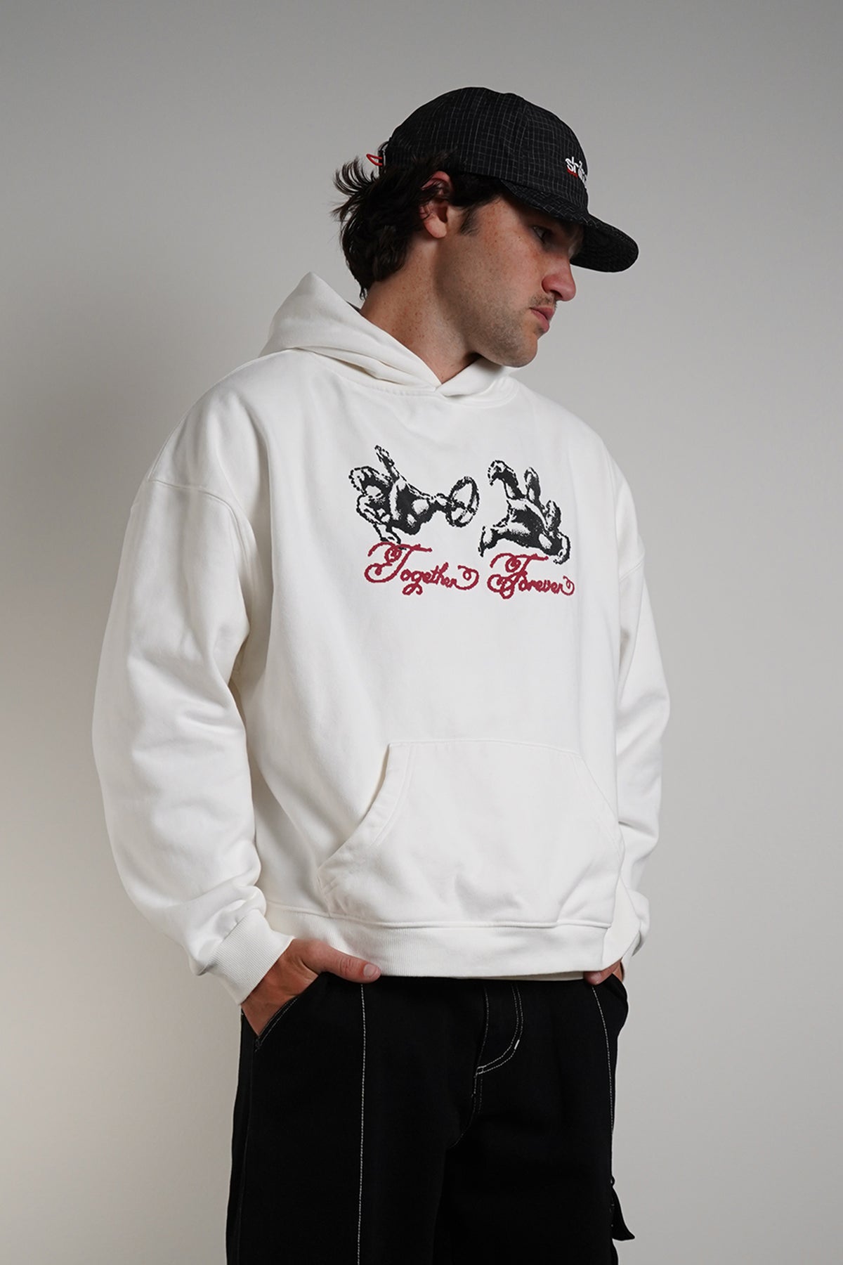 White Together Forever Hoodie with black hands-and-ring graphic and red Together Forever script, front view in model