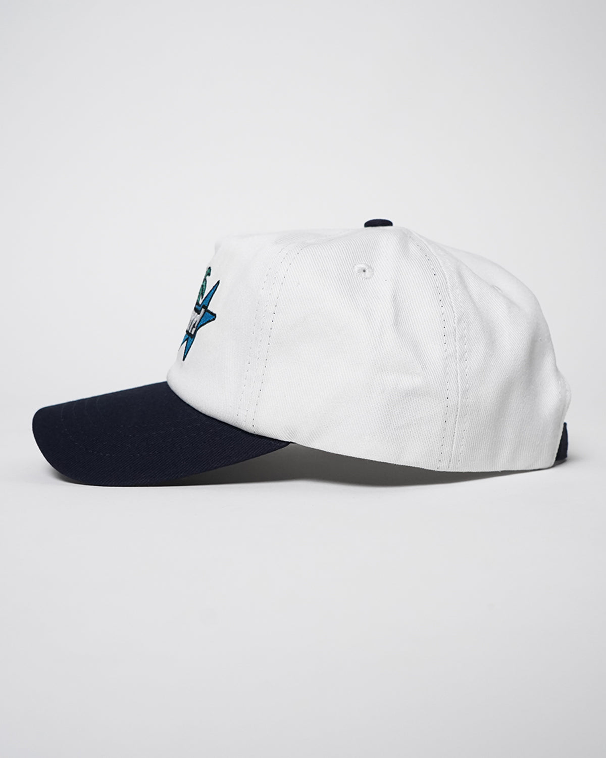 White Superrrr Hat with navy bill, side view showing edge of the embroidered star logo