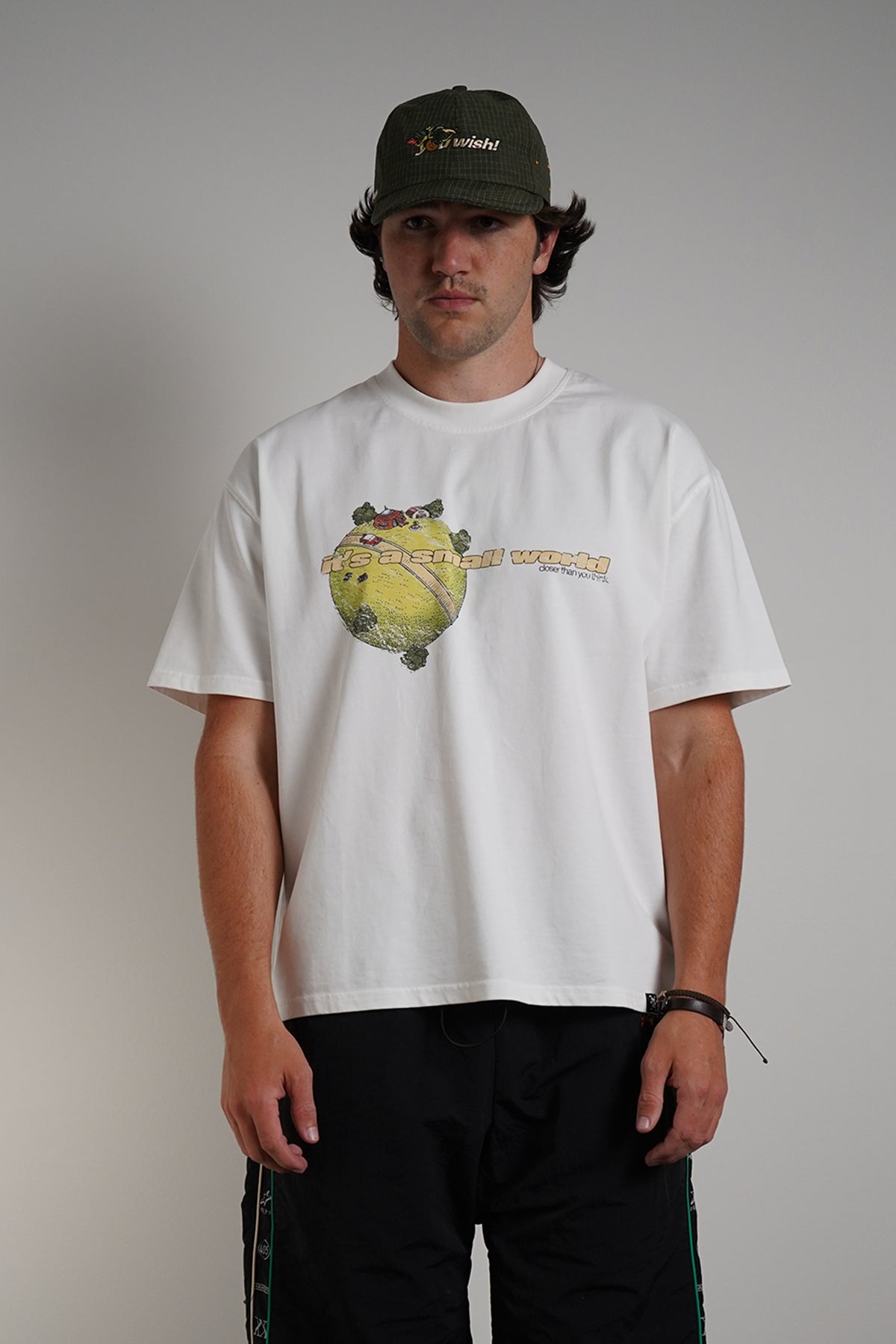 White Dragonball 40th Anniversary Tee with yellow graphic print, front view on model