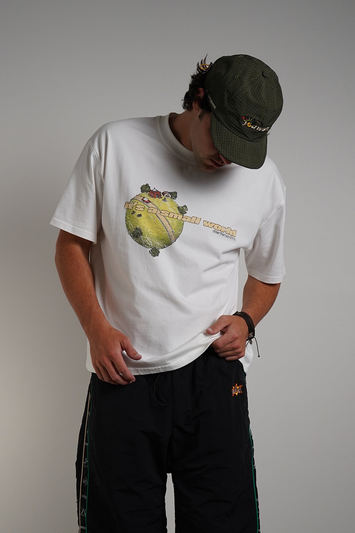 White Dragonball 40th Anniversary Tee with yellow graphic print, front view on model