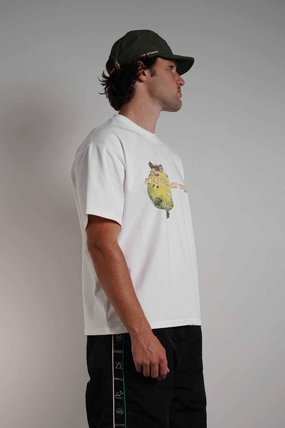 White Dragonball 40th Anniversary Tee with yellow graphic print, front view on model