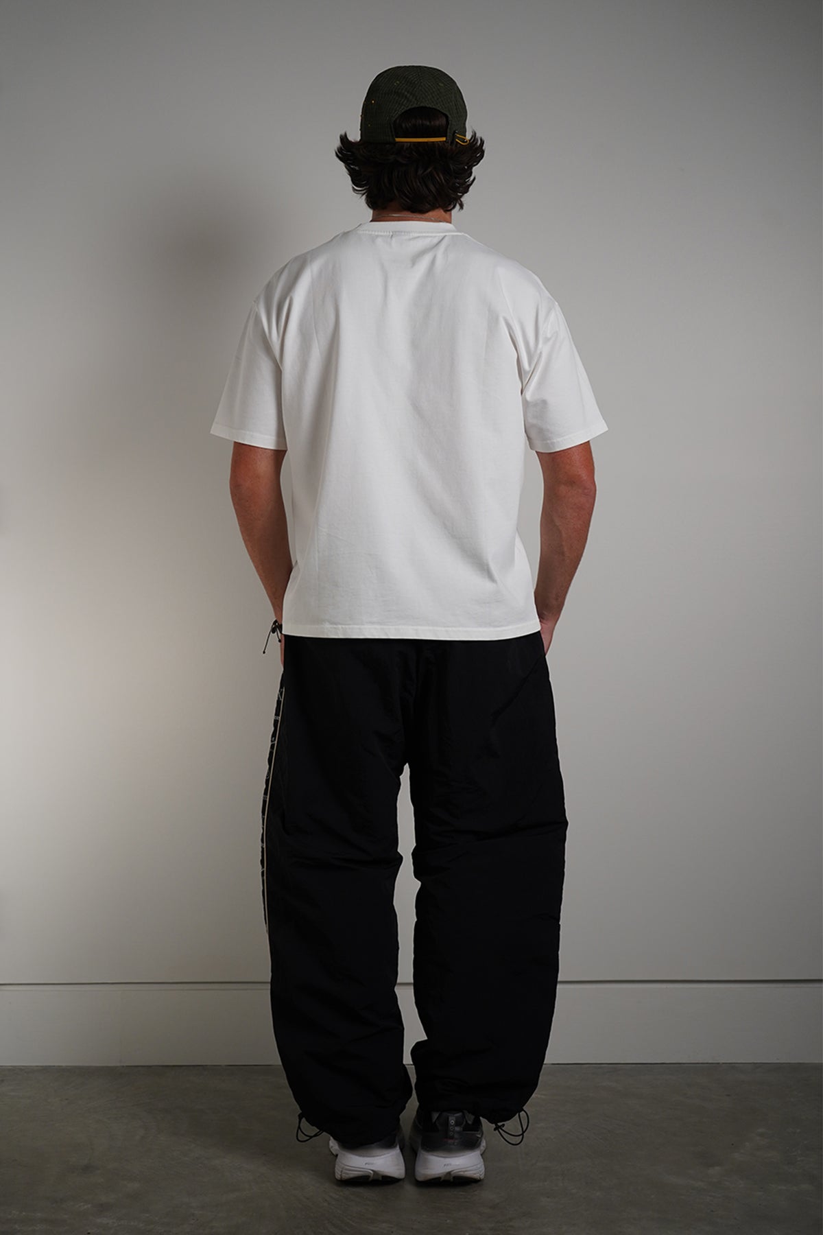 White Dragonball 40th Anniversary Tee with yellow graphic print, back view on model
