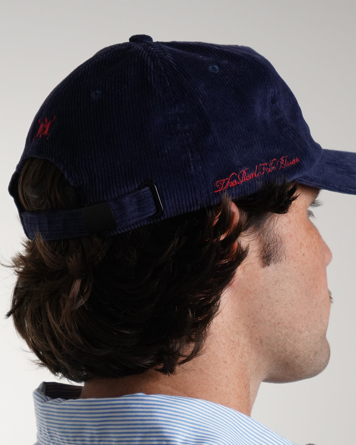 Easy Come Easy Go Hat in Midnight Blue corduroy with red script text, side view.