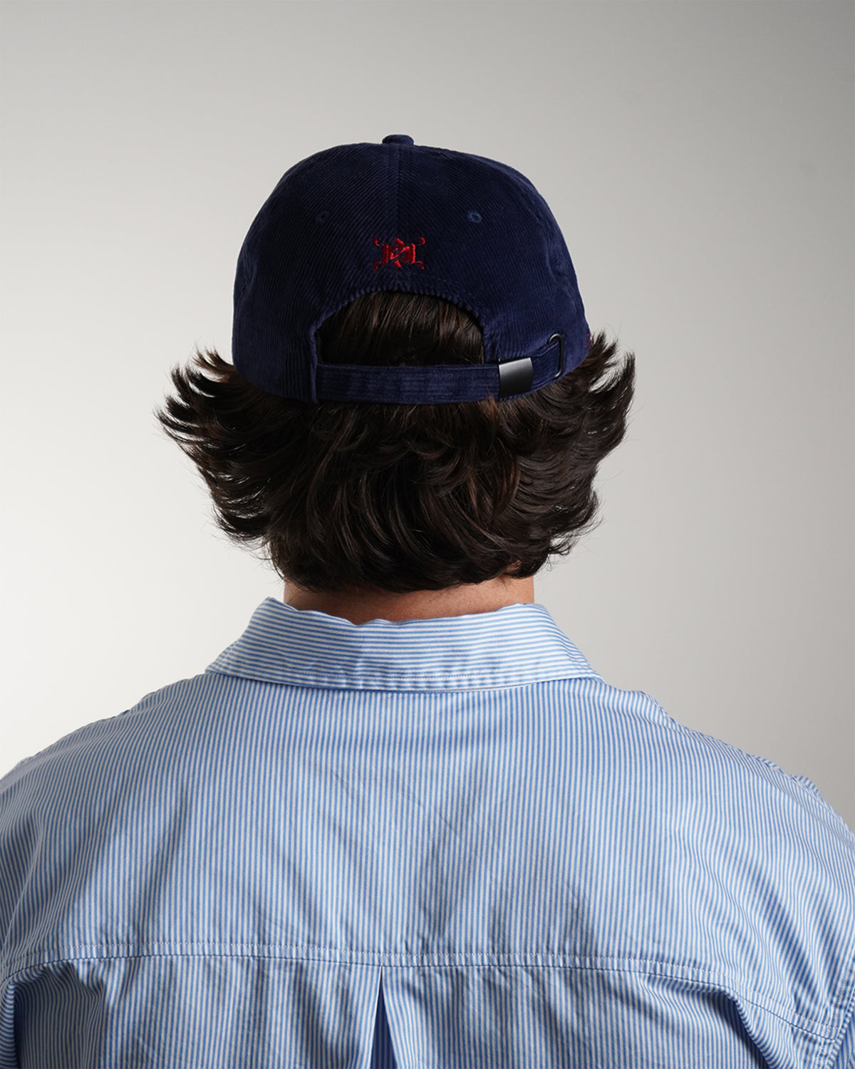 Easy Come Easy Go Hat in midnight blue with red embroidered logo, back view.