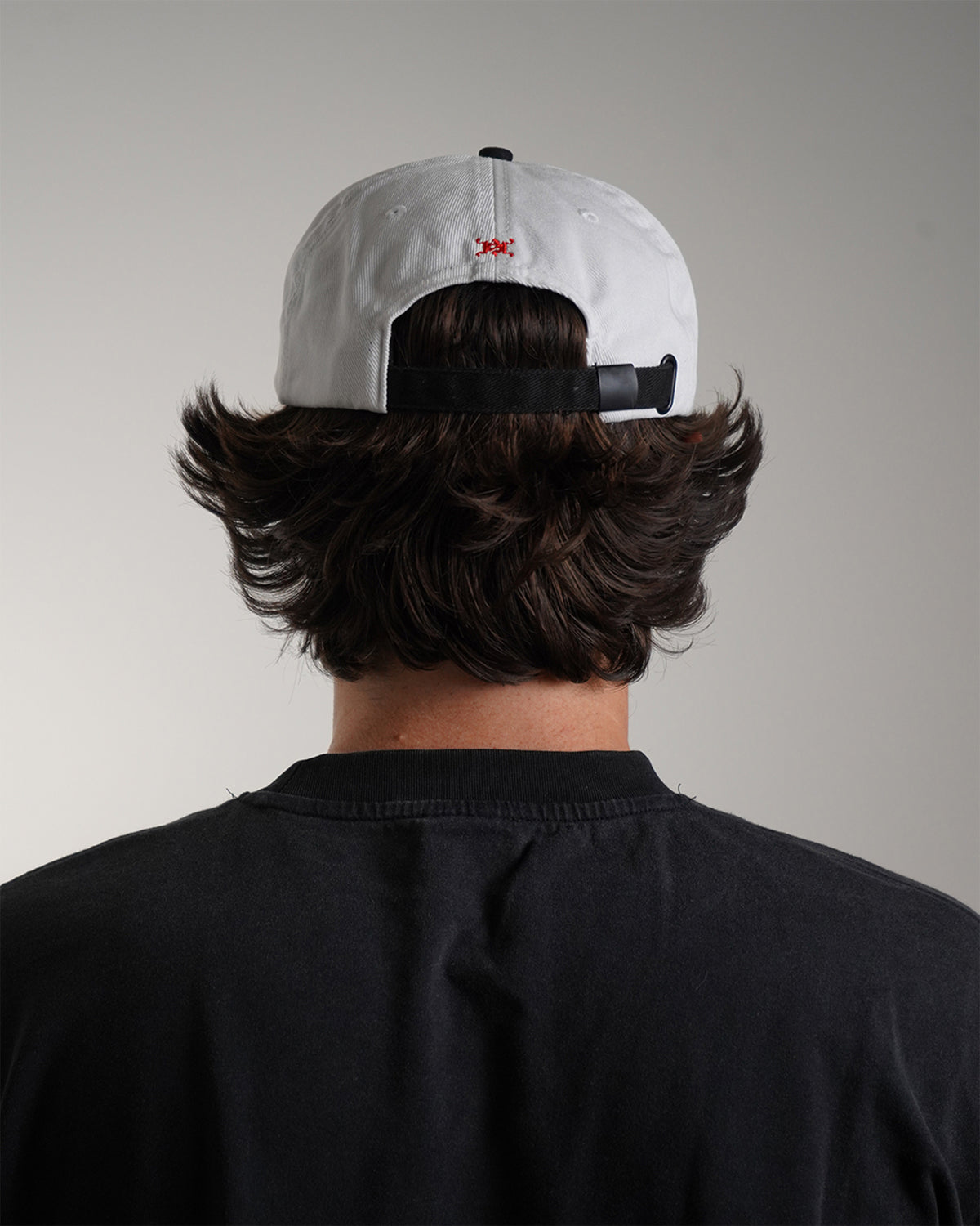White Valentine Hat with red haki logo graphic, back view on model