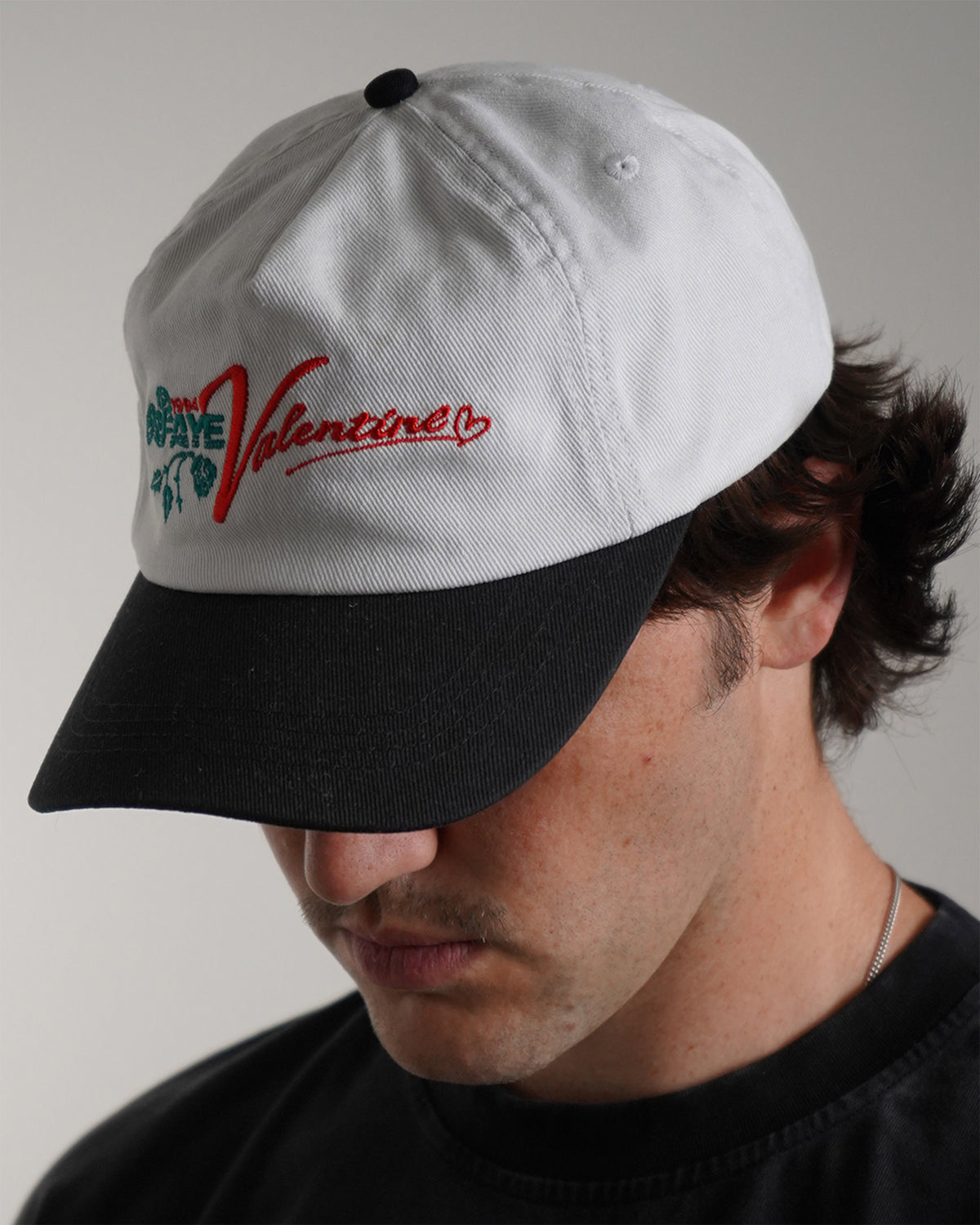 White Valentine Hat with red haki logo graphic, front view on model