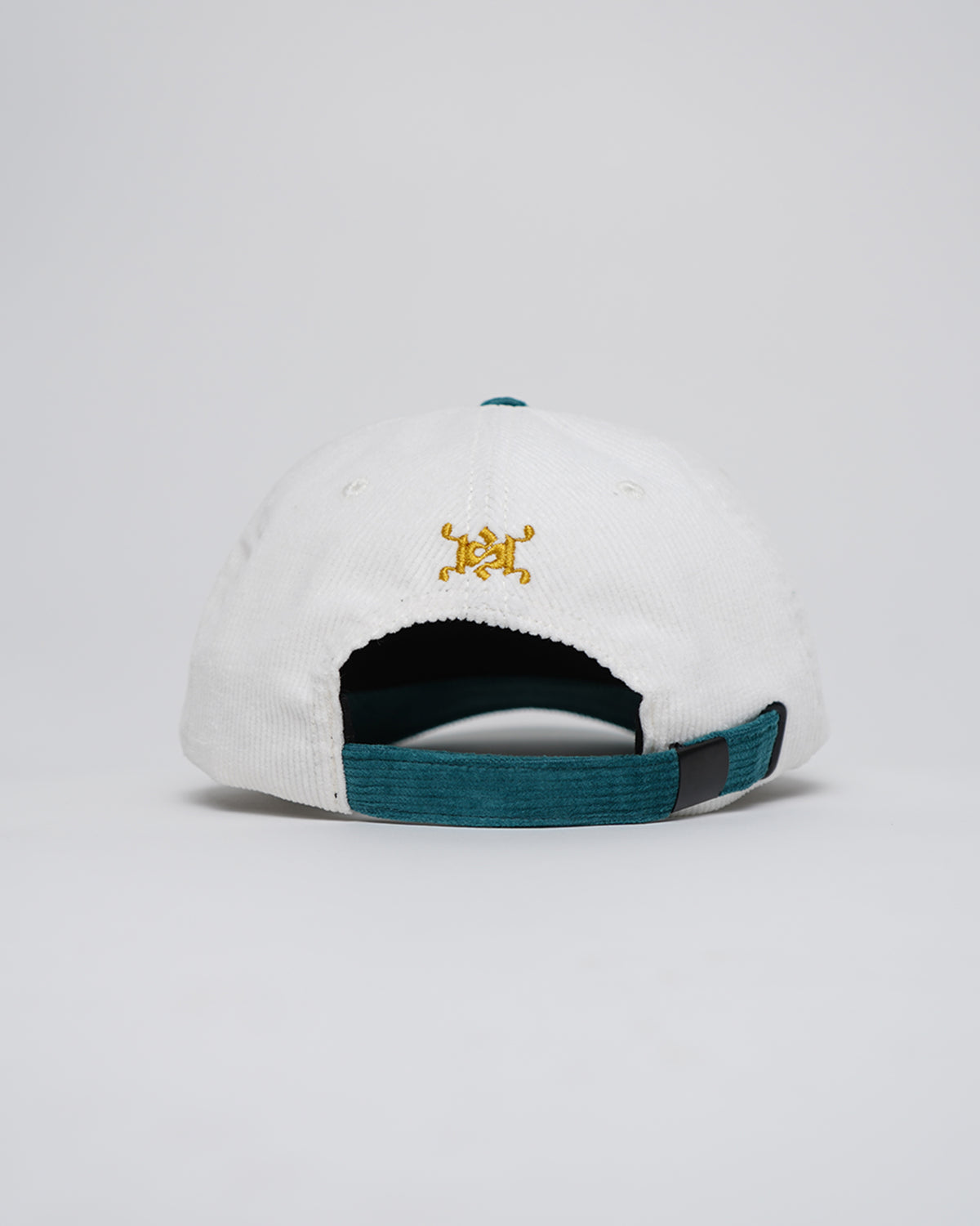 Back view of the white corduroy Rain Dinners Hat with teal strap and brim, and a small gold embroidered emblem