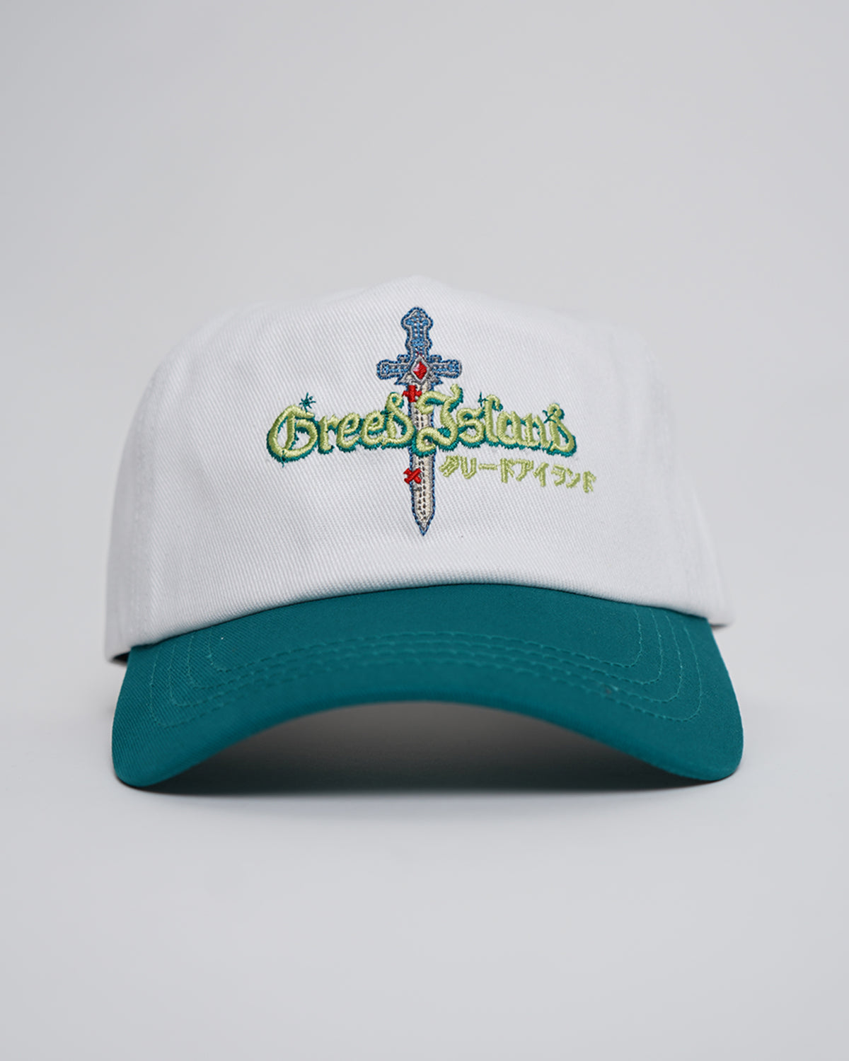 White and teal Greed Island Hat with embroidered dagger, green script and Japanese text, front view
