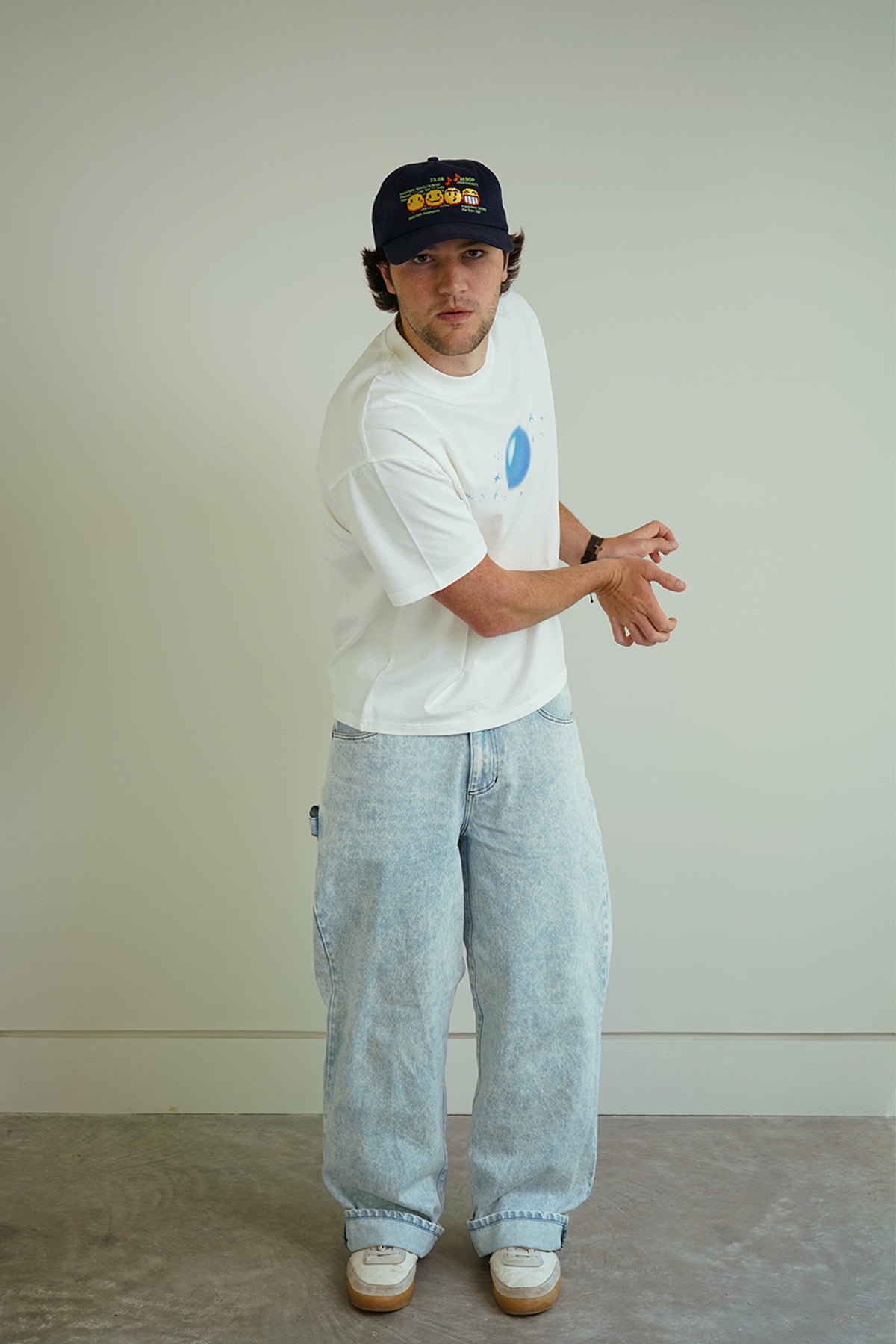 White Dragonball 40th Anniversary Tee with blue sphere graphic, front view on model