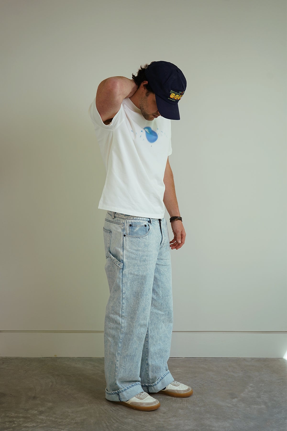White Dragonball 40th Anniversary Tee with blue sphere graphic, front view on model