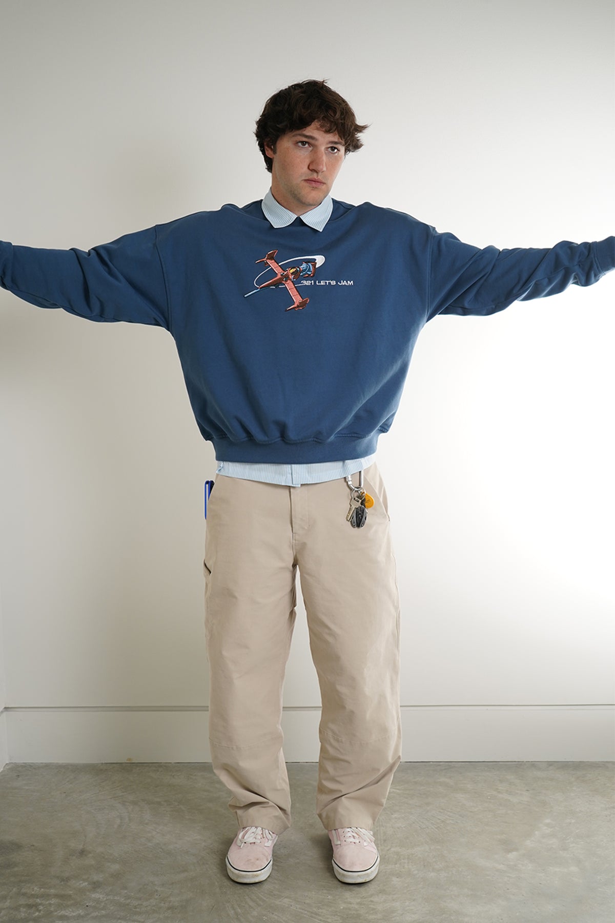 Blue Let's Jam Crewneck with embroidered spaceship and 321 LET'S JAM text, front view on model
