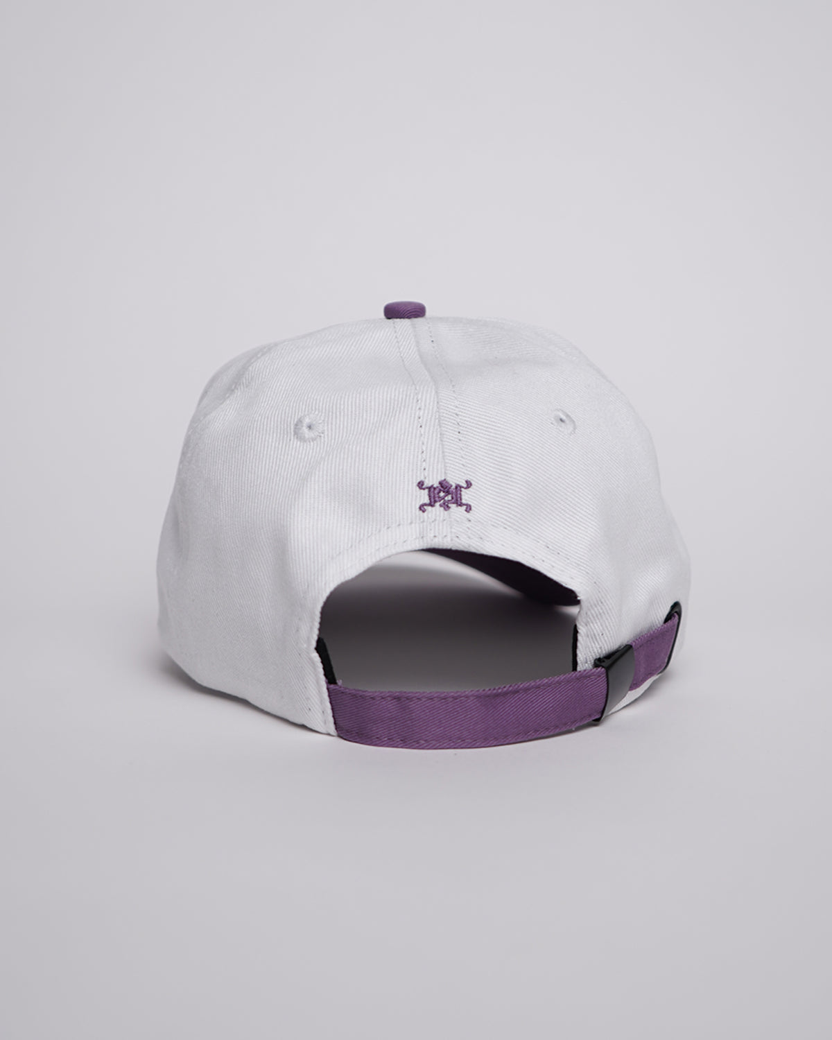Guardian Deity Hat in white with purple accents, back view showing adjustable strap